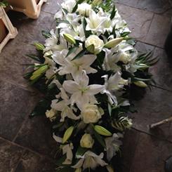 Classic white lilies and roses casket spray